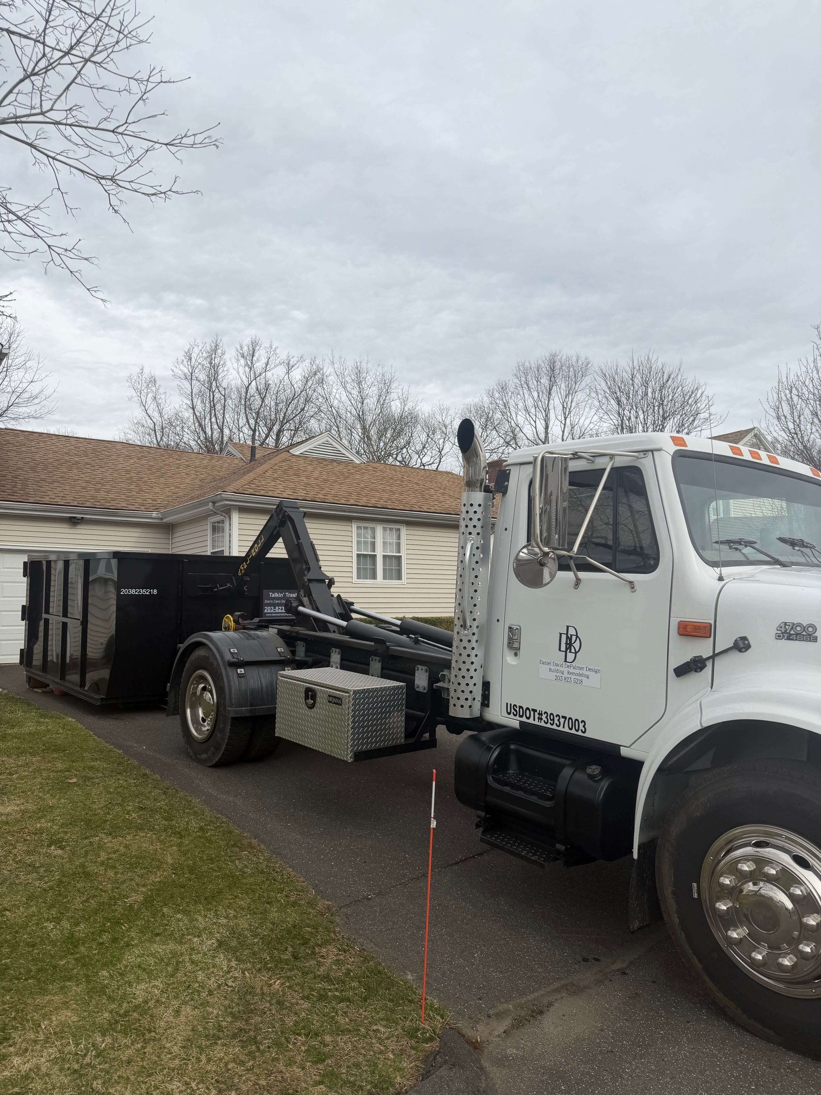 Roll-off dumpster in use for a local Connecticut residential or contractor job